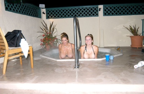 MILF Kelly Madison and big titted babe have fun with their big tits in jacuzzi