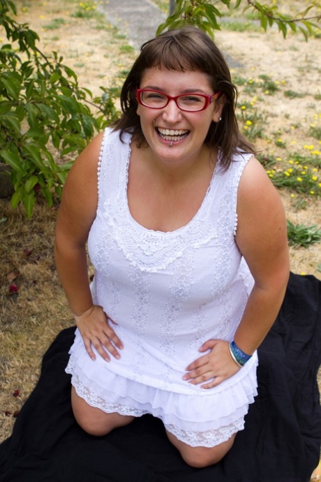 Fat amateur brunette with glasses Betty H shows off her giant tits outdoors