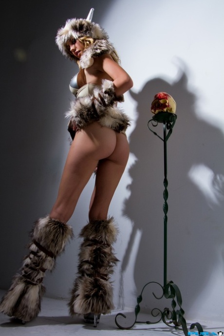 Kinky American pornstar Brett Rossi reveals her fakes tits and poses in fur