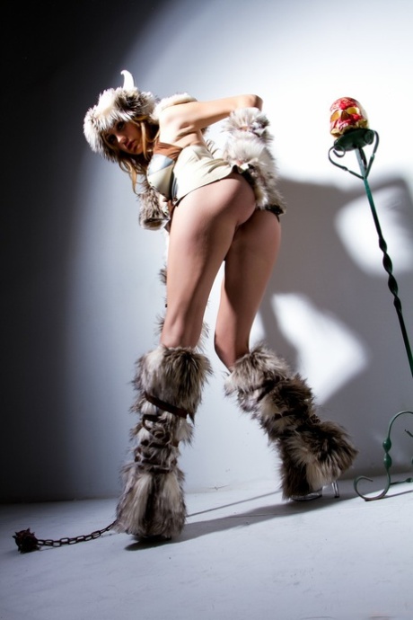 Kinky American pornstar Brett Rossi reveals her fakes tits and poses in fur