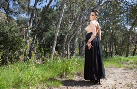 Dark queen Chanel Preston unveiling her boobs and firm booty in the forest