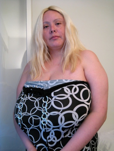 Chubby blonde Dalila lets out her magnificent breasts and flaunts them