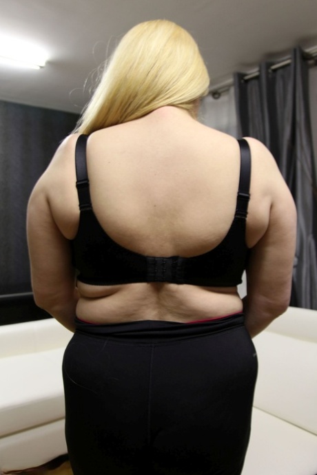 Chubby blonde Dalila lets out her magnificent breasts and flaunts them