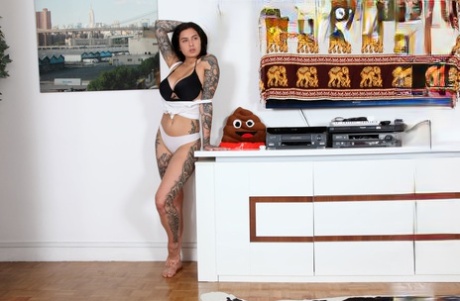 Heavily tattooed brunette Evgenia Talanina flaunting her big tanned tits