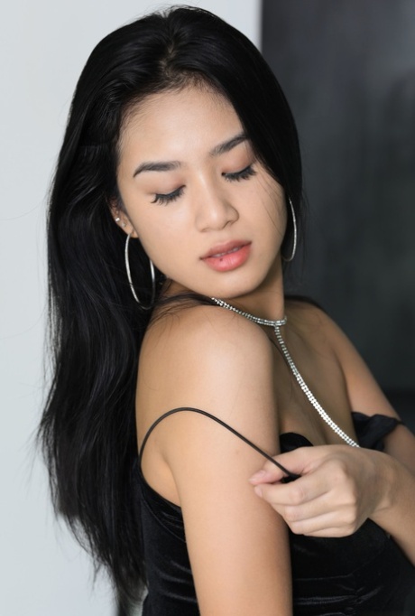 Bosomy brunette beauty Kahlisa displaying her inviting hairy pussy up close