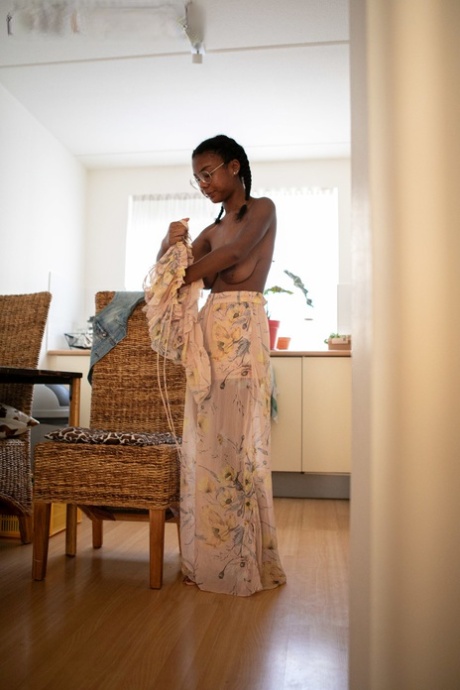 Ebony teen with a sweet ass and big tits Selena D dresses in a white dress