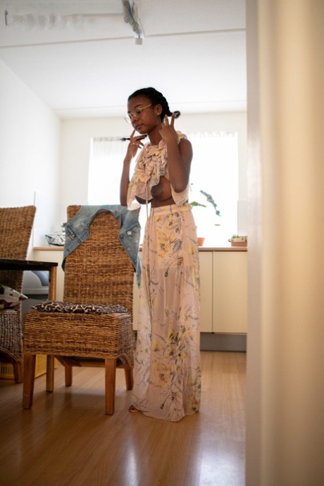 Ebony teen with a sweet ass and big tits Selena D dresses in a white dress