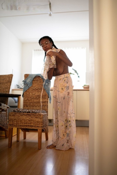 Ebony teen with a sweet ass and big tits Selena D dresses in a white dress