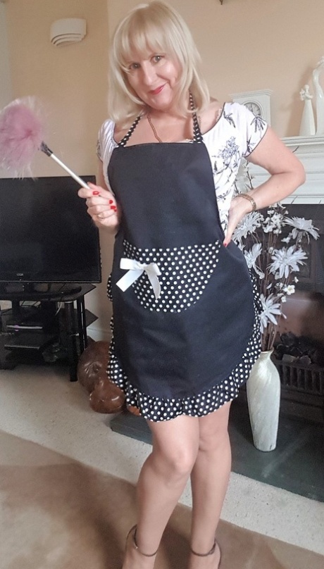 Mature housewife Lorna Blu teases with a big veggie after shedding her panties