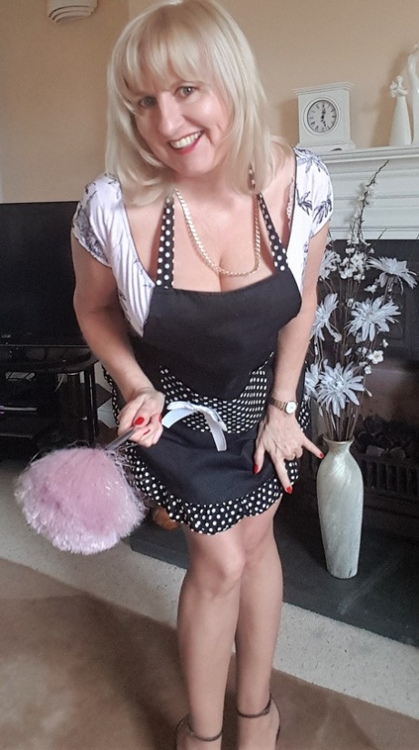 Mature housewife Lorna Blu teases with a big veggie after shedding her panties