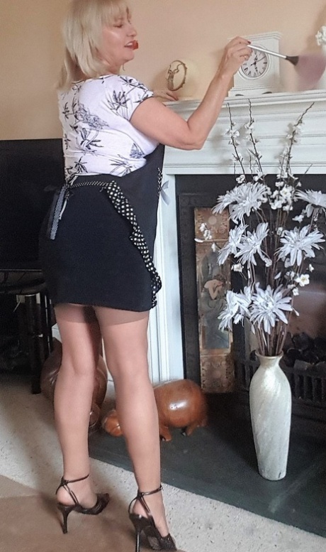 Mature housewife Lorna Blu teases with a big veggie after shedding her panties