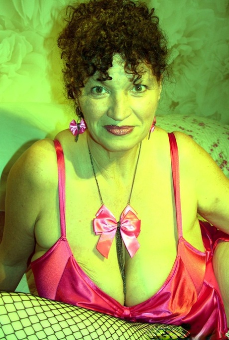 Chubby cougar in shiny lingerie Kim unveils her grand bosom in a solo