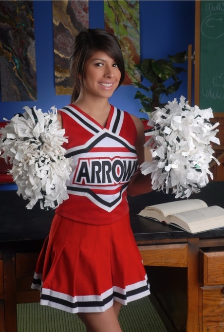 Adorable cheerleder Layla Rose reveals her huge breasts and fingers her twat
