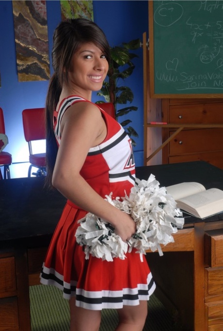 Adorable cheerleder Layla Rose reveals her huge breasts and fingers her twat