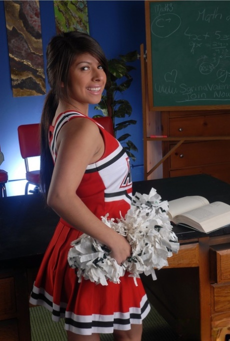 Adorable cheerleder Layla Rose reveals her huge breasts and fingers her twat
