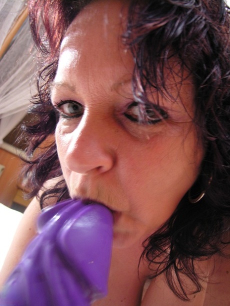 Mature Hetty showcases her big tits with pierced nipples before masturbating