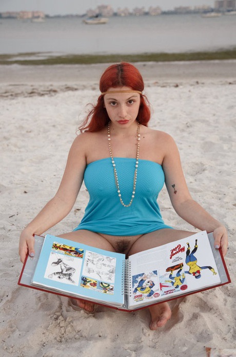 Curvaceous redhead Gina Rosini flashes her big tits, round ass and hairy twat