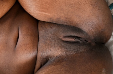 Exotic ebony Daya Knight unveils her big breasts and stretches her black clam