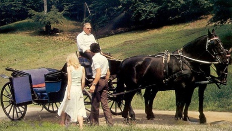 Horny girls take a horse ride before sharing a stiff boner in a vintage 3some
