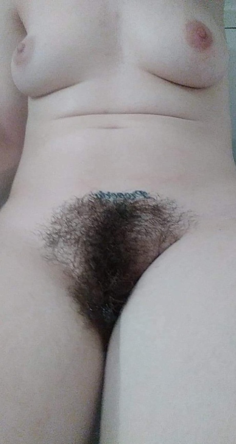 Amateur honey with big tits Amanda Marks teases with her bushy pussy in a tub