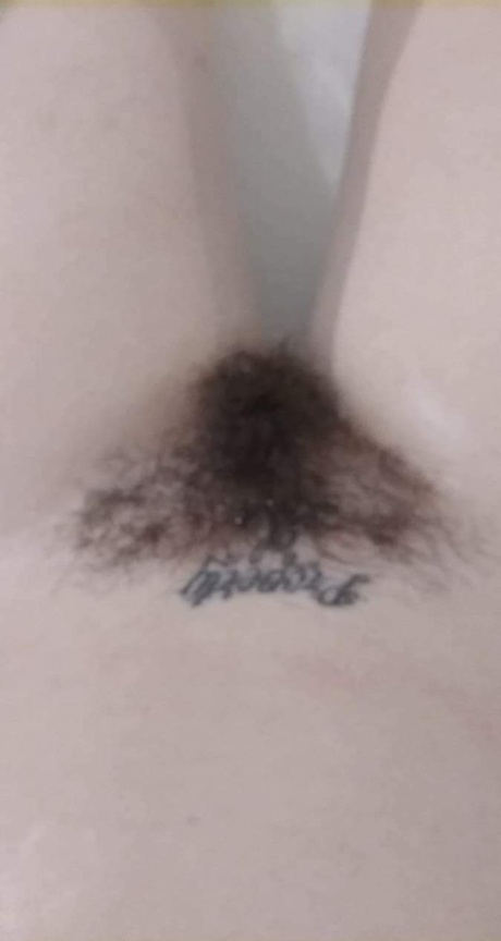 Amateur honey with big tits Amanda Marks teases with her bushy pussy in a tub