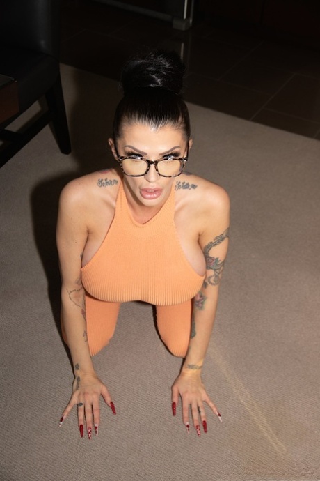 Curvaceous MILF Joslyn James teases with her big tits in a jumpsuit & heels