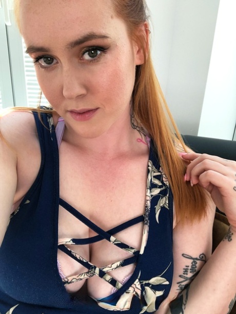 Redheaded babe with pierced big tits Alice W shows her ass to a bald dude