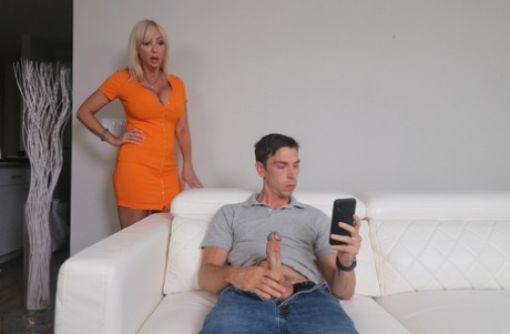 Naughty busty MILF Victoria Lobov gives her masturbating stepson a handjob