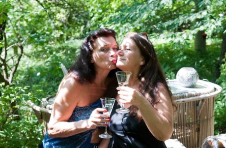 Two big-boobed mature women having 3way sex with a boy in nature