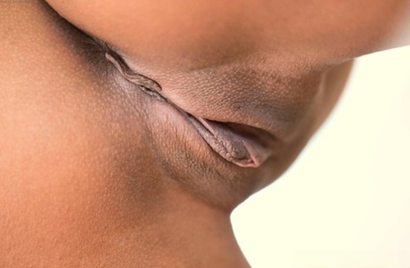 Charming ebony babe Anya Ivy unveils her amazing tits and fingers herself