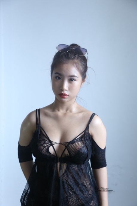 Kinky Asian honey poses completely nude and teases with her big tits and ass
