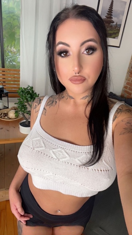 Sexy inked MILFs with big tits Sky Fox and Eva Rose pose naked on a couch