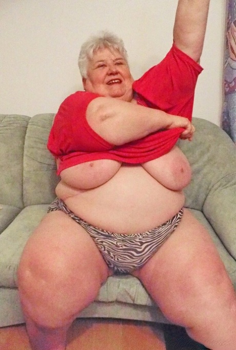 Fat granny Akula shows off her huge saggy tits while changing in a solo