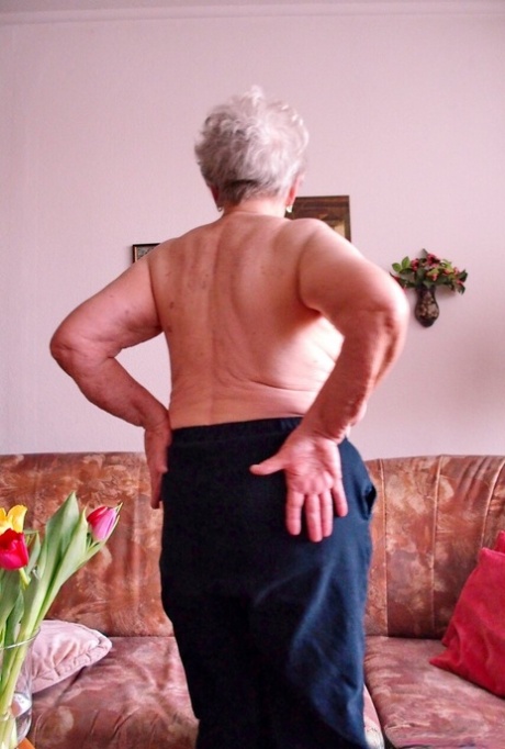 Short-haired granny Medora goes topless and shows her huge saggy tits