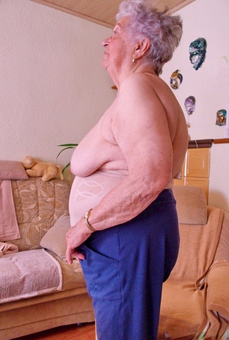 Kinky fat granny Pulcheria poses naked in a solo home striptease